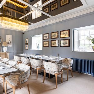 Room shot of the River Room in Blackpool Mill Restaurant. Stylish set up with pigeon blue column radiators